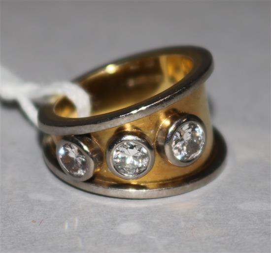 An 18ct gold three stone diamond ring